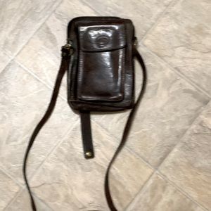 The tread crossed body bag. A few little wear marks.